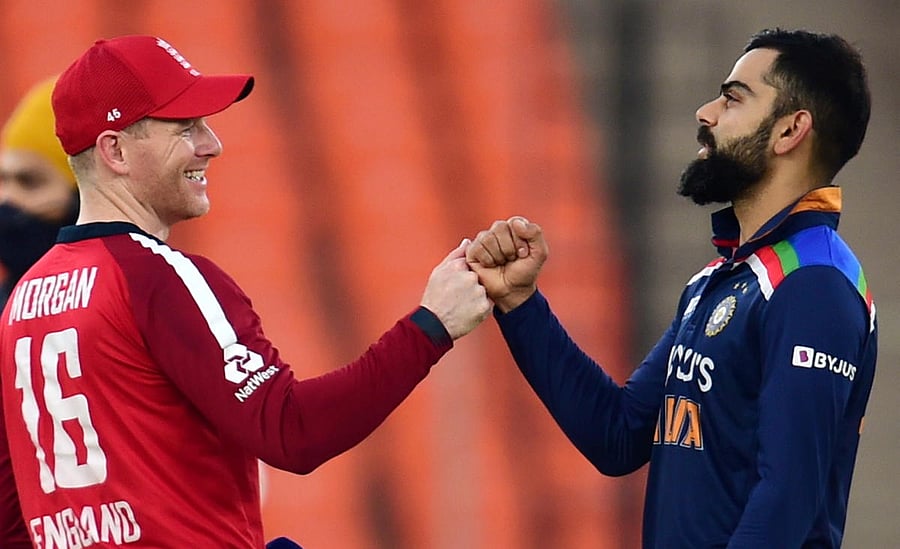 England skipper Eoin Morgan and Indian skipper Virat Kohli. Credit: PTI photo.