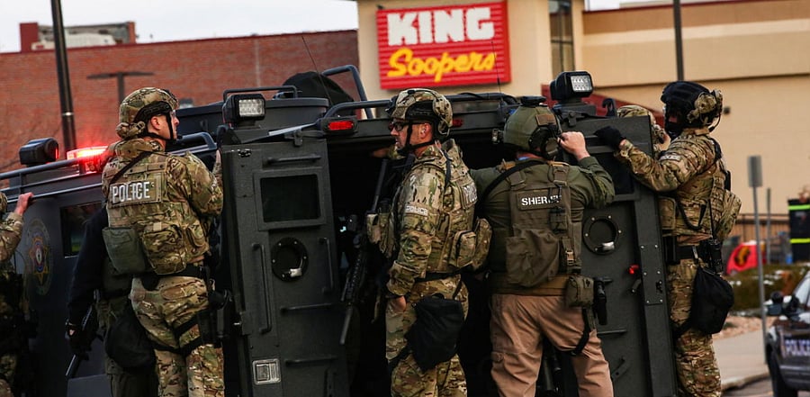 Law enforcement officers in tactical gear are seen at the site of a shooting at a King Soopers grocery store in Boulder, Colorado, US. Credit: Reuters photo.
