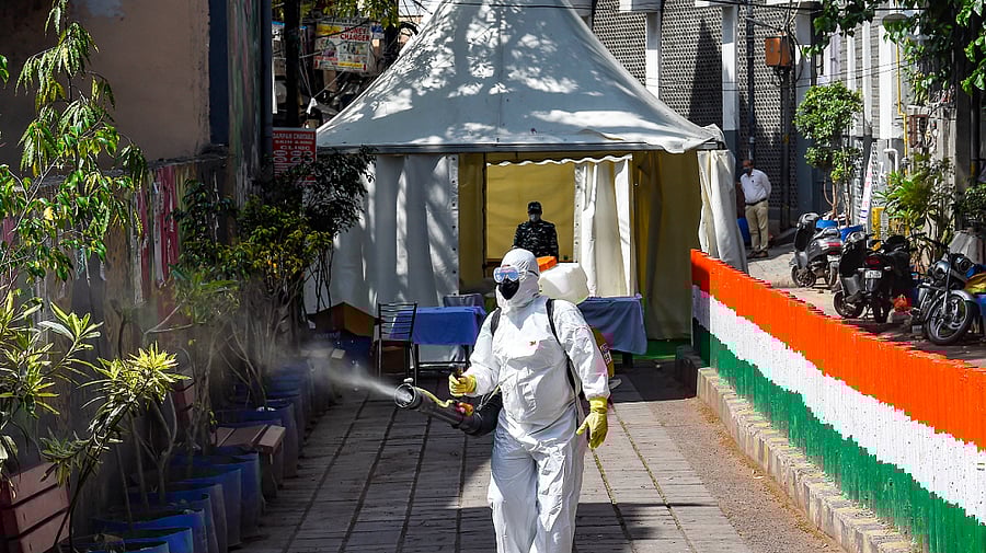 A health worker sanitises an area near Nizamuddin mosque. Credit: AFP Photo