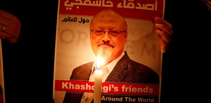 A demonstrator holds a poster with a picture of Saudi journalist Jamal Khashoggi outside the Saudi Arabia consulate in Istanbul. Credit: Reuters Photo