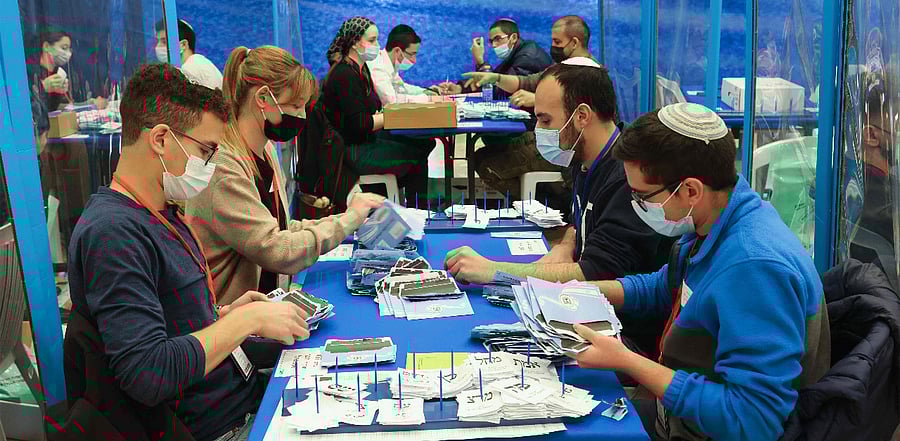 Electoral staff count ballots in Israel's general elections in Jerusalem. Credit: AFP Photo