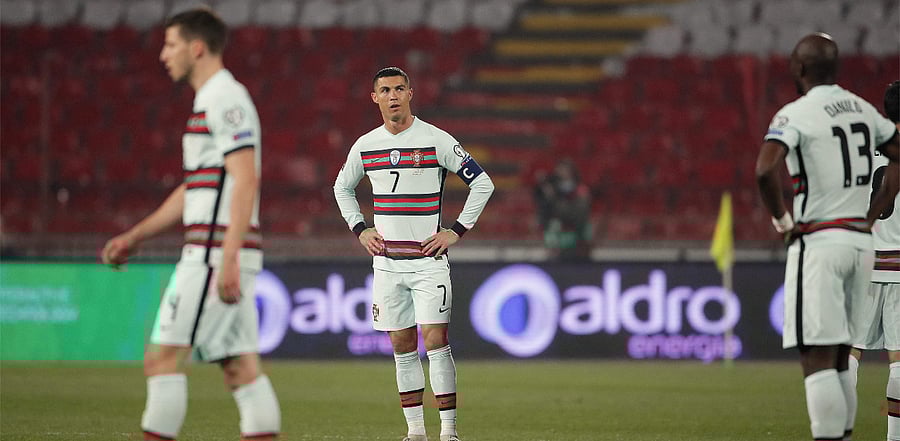 Portugal's forward Cristiano Ronaldo (C) reacts at the end of the FIFA World Cup Qatar 2022 qualification Group A football match between Serbia and Portugal. Credit: AFP Photo