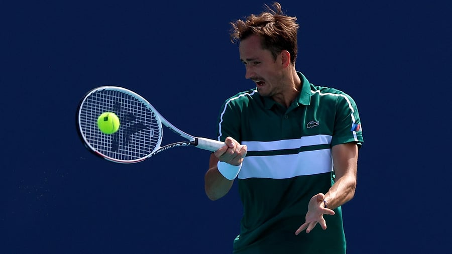 Daniil Medvedev of Russia returns a shot during his men's singles third round match against Alexei Popyrin of Australia on Day 7 of the 2021 Miami Open presented by Itaú at Hard Rock Stadium on March 28, 2021 in Miami Gardens, Florida. Credit: Mark Brown/Getty Images/AFP
