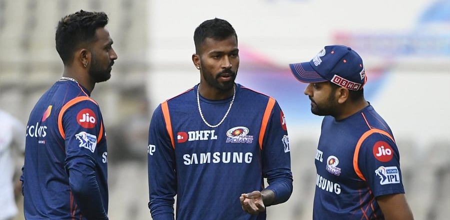 Rohit Sharma with teammates Krunal and Hardik Pandya. Credit: PTI Photo