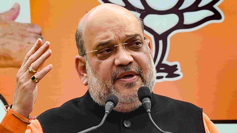 Amit Shah said people's participation in the election process will ensure peace and prosperity in the two states. Credit: PTI Photo