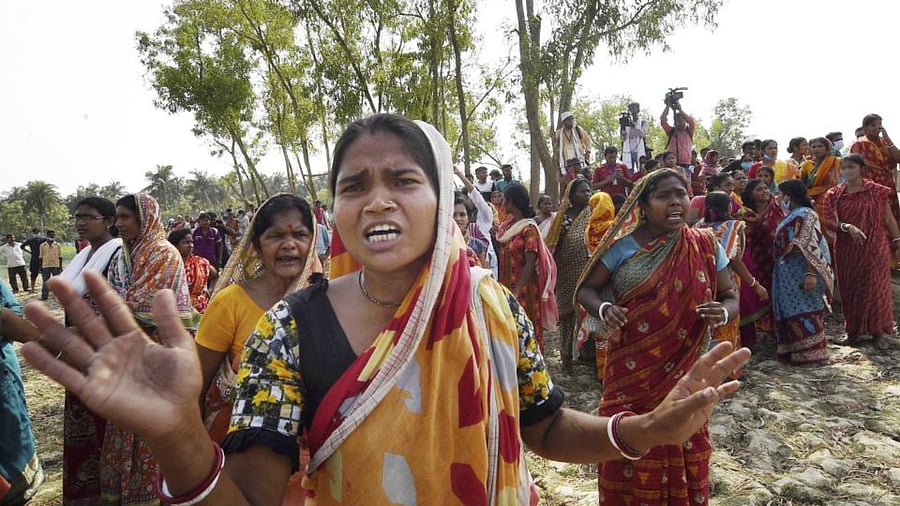 Villagers raise slogans against West Bengal Chief Minister Mamata Banerjee, waiting inside a polling station, during the second phase of West Bengal assembly polls, at Boyal in Nandigram, Thursday, April 1, 2021. Credit: PTI Photo