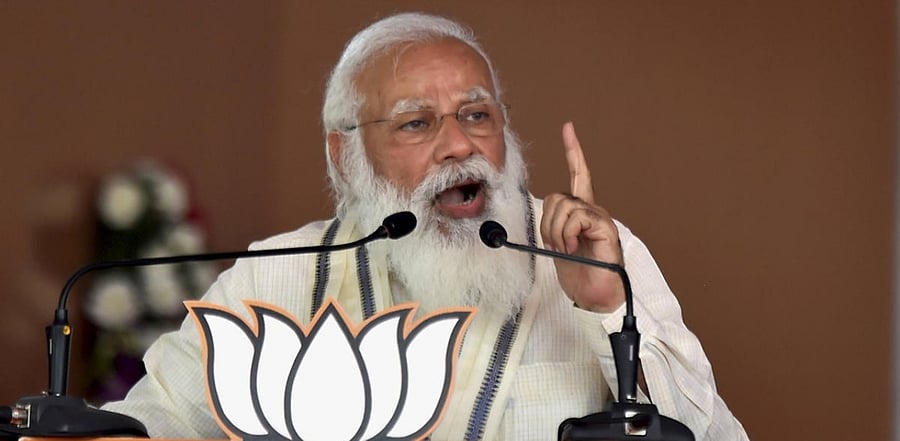 Prime Minister Narendra Modi addresses a public meeting as part of election campaign in support of their NDA alliance party candidates ahead of Tamil Nadu assembly polls, in Madurai. Credit: PTI Photo