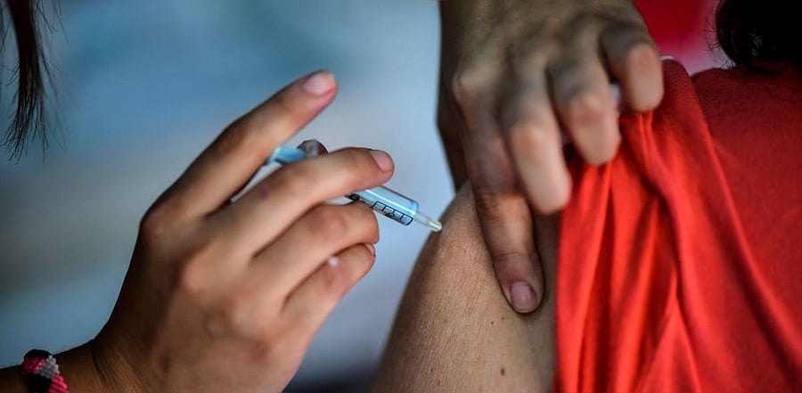 A health worker applies a dose of the Sputnik V vaccine against Covid-19, at the Centenario stadium in Quilmes, Buenos Aires province. Credit: AFP photo.