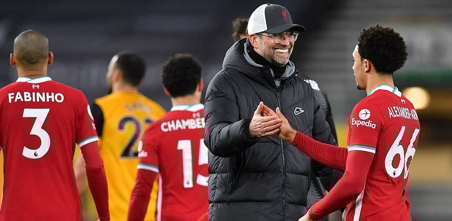 Liverpool Manager Jurgen Klopp and Trent Alexander-Arnold. Credit: AFP Photo