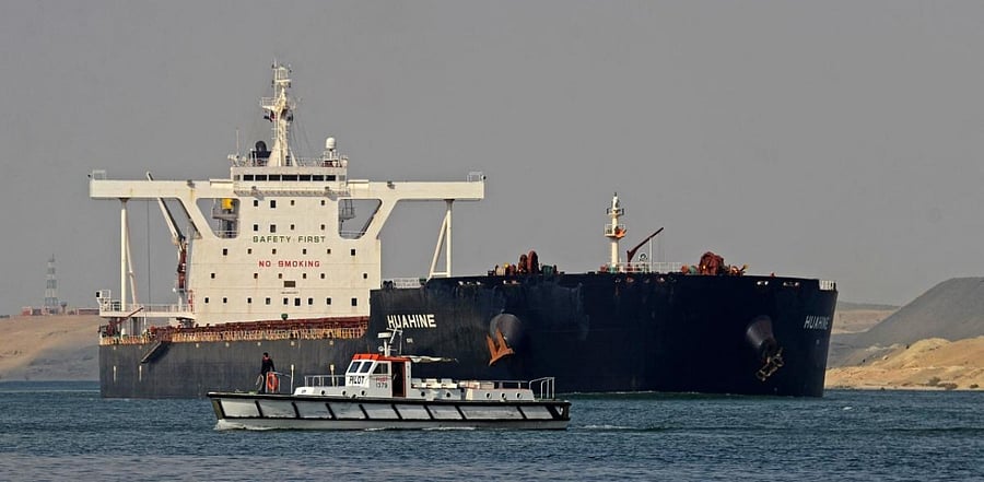 Egyptian coast guards patrol as a ship navigates the Suez Canal. Credit: AFP Photo