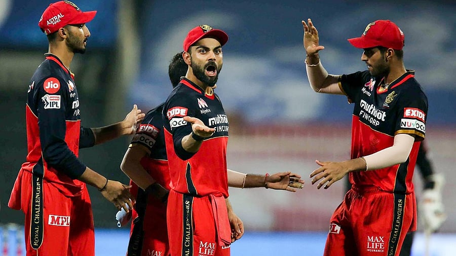 Royal Challengers Bangalore captain Virat Kohli with his team. Credit: PTI Photo