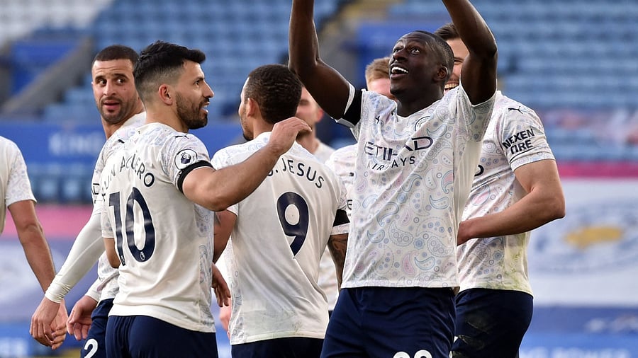 Manchester City's French defender Benjamin Mendy (R) celebrates scoring the opening goal during the English Premier League football match between Leicester City and Manchester City. Credit: AFP Photo