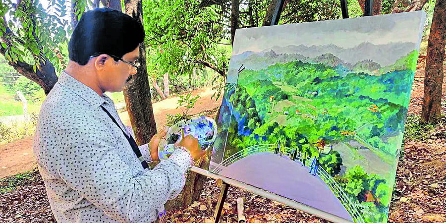 An artist recreates the beauty of Kodagu on canvas during the art camp.