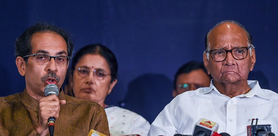 Shiv Sena chief Udhhav Thackeray (L) with NCP chief Sharad Pawar. Credit: AFP Photo