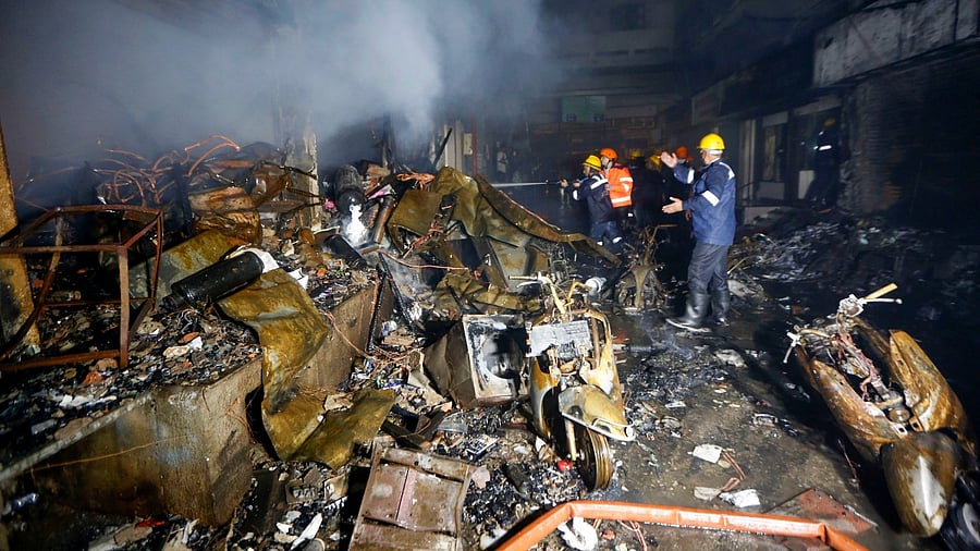 Fire fighters attempt to douse a fire, in Ahmedabad. Credit: PTI file photo.