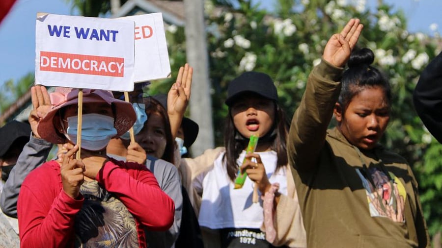 This handout photo taken and released by Dawei Watch on April 6, 2021 shows protesters holding up the three finger salute during a rally against the military coup in Launglone township in Myanmar's Dawei district. Credit: AFP Photo