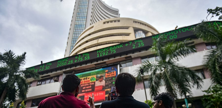 Bystanders outside the BSE building in Mumbai. Credit: PTI Photo