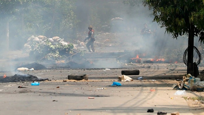 Members of the armed forces stand guard during a protest against the military coup, in Yangon, Myanmar. Credit: Reuters Photo