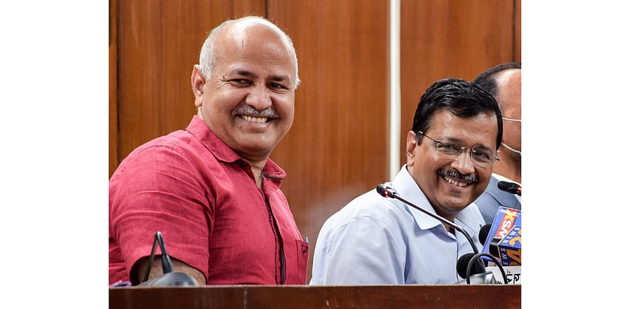 Aam Aadmi Party's Manish Sisodia (L), CM Arvind Kejriwal. Credit: PTI Photo