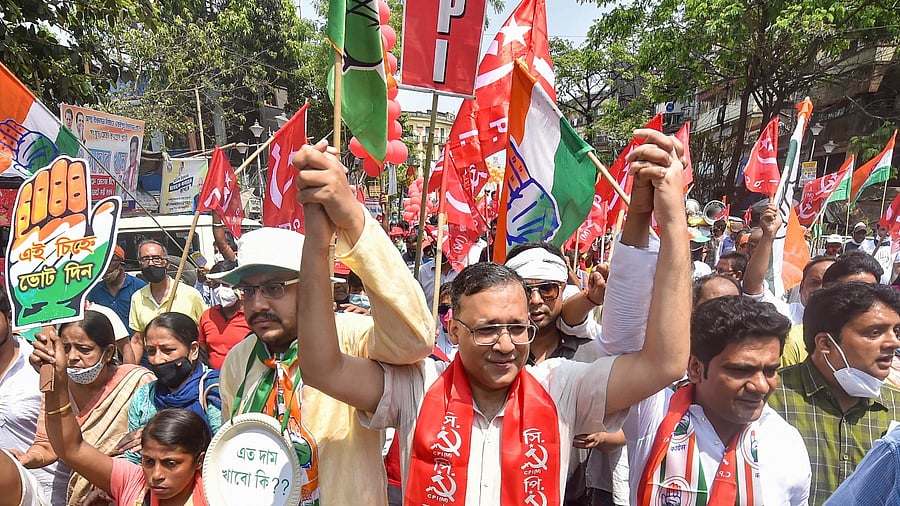 Sayukta Morcha candidates Fuad Halim of CPI(M), Ashutosh Chatterjee of Congress and Sadab Khan (R) of Congress in a joint rally before filing their nomination papers for the Assembly polls, in Kolkata, Monday, April 5, 2021. Credit: PTI Photo