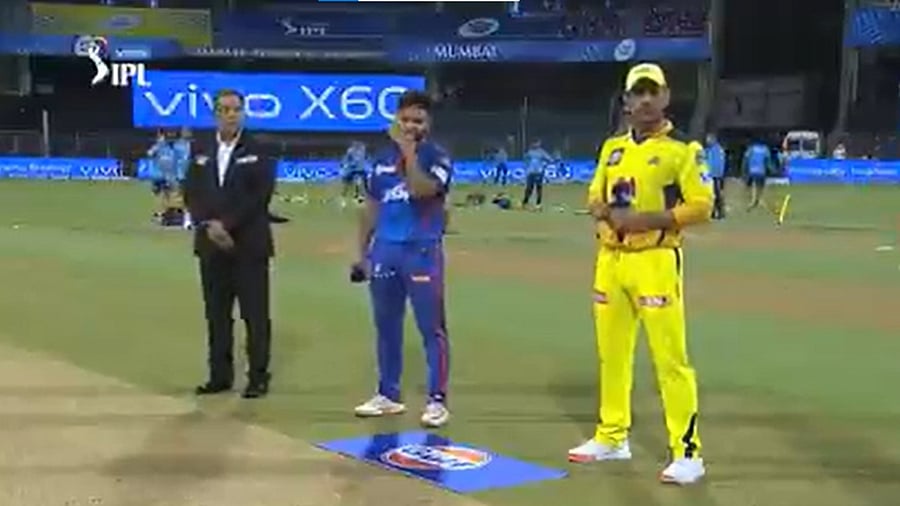 Delhi Capitals skipper Rishabh Pant (C) and Chennai Super Kings captain M S Dhoni ahead of the toss. Credit: Screenshot via Twitter/@IPL