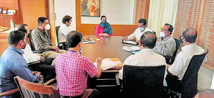 Deputy Commissioner Charulata Somal chairs a meeting in Madikeri.