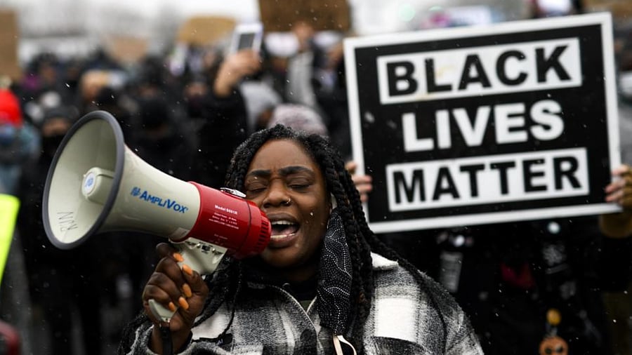 Protesters march outside the Brooklyn Center police headquarters on April 13, 2021 in Brooklyn Center, Minnesota. Credit: AFP Photo