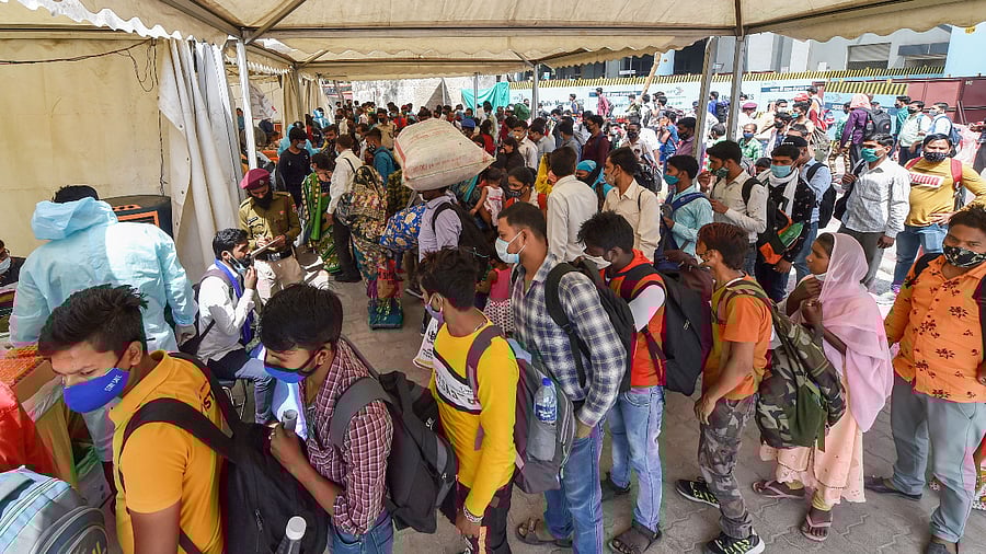 Passengers wait to be tested for Covid-19 in Delhi. Credit: PTI Photo