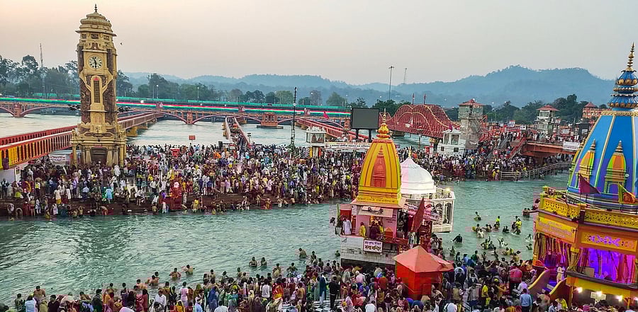 Devotees gather to offer prayers during the third 'Shahi Snan' of the Kumbh Mela. Credit: PTI Photo