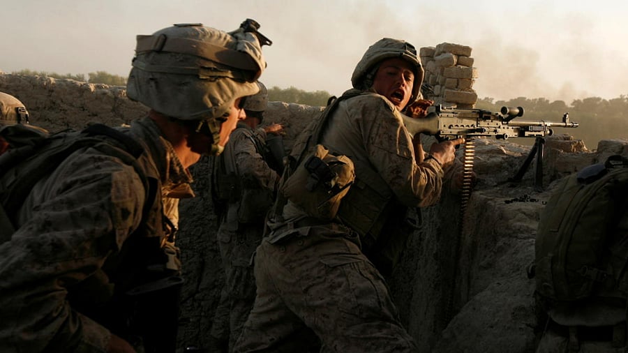 US Marines fire during a Taliban ambush. Credit: Reuters file photo.