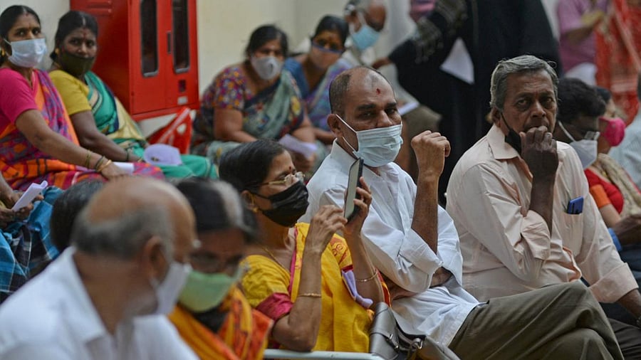 People wait for their turn to receive the coronavirus vaccine at a government hospital in Chennai. Credit: AFP photo.