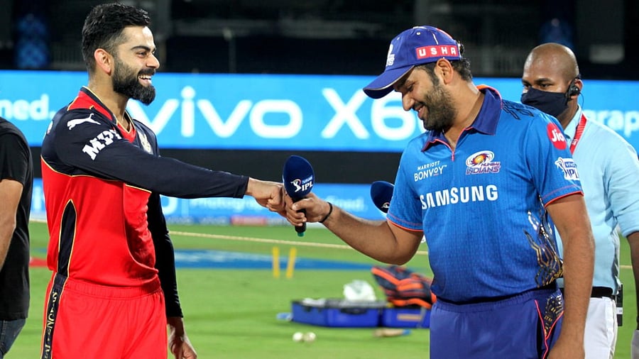 RCB skipper Virat Kohli and Mumbai Indian's captain Rohit Sharma at the toss for the IPL opener. Credit: PTI File Photo