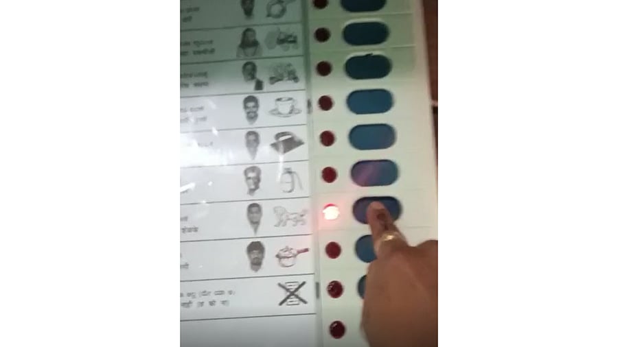 In the 11-second video, the unidentified voter who shot the video can be seen running his finger across the ballot unit, voting for Shelke and then raising his thumb. Credit: Special Arrangement