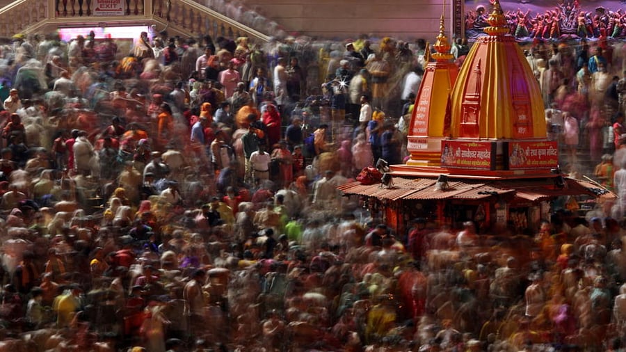 Hindu devotees take a holy dip in the Ganges river during Shahi Snan at "Kumbh Mela", or the Pitcher Festival, amidst the spread of the coronavirus disease in Haridwar, India, April 14, 2021. Credit: Reuters Photo
