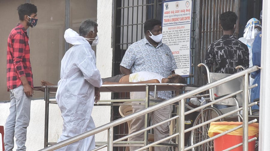 A non-Covid patient is being shifted out of Victoria Hospital in Bengaluru on Friday. Credit: DH PHOTO/JANARDHAN B K