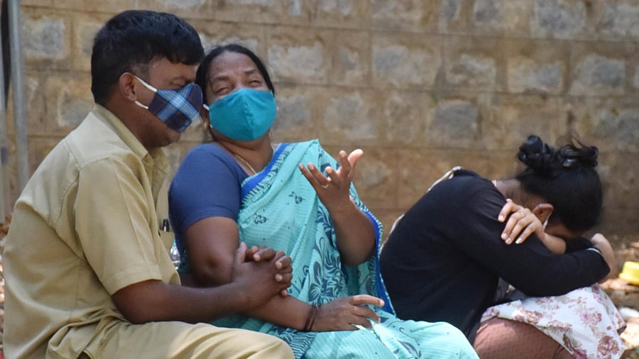 A family members mourn at the campus of KC General hospital after Covid attack one of their family member in critically condition, in Bengaluru. Credit: DH photo.
