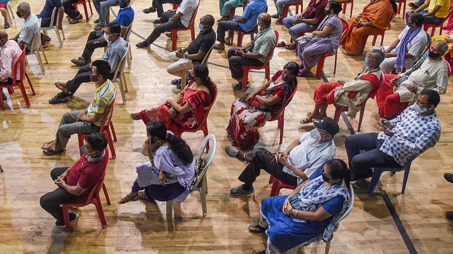 Beneficiaries wait at a health centre to receive the dose of Covid-19 vaccine amid surge in coronavirus cases, in Guwahati, Thursday, April 22, 2021. Credit: PTI Photo
