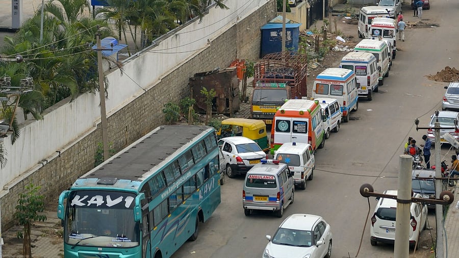 Ambulances carrying the body of Covid-19 victims line outside a municipal crematorium in Bengaluru on April 21, 2021. Credit: AFP photo