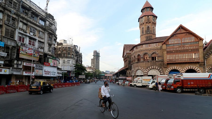 A man rides his bicycle during a lockdown to limit the spread of the coronavirus in Mumbai, India, April 23, 2021. Credit: Reuters Photo