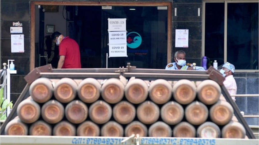 A truck with oxygen cylinders at a private hospital in Bengaluru on Friday. Credit: DH Photo/Pushkar V