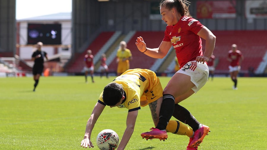 Manchester United's Carrie Jones in action with Tottenham Hotspur's Ashleigh Neville. Credit: Reuters Photo