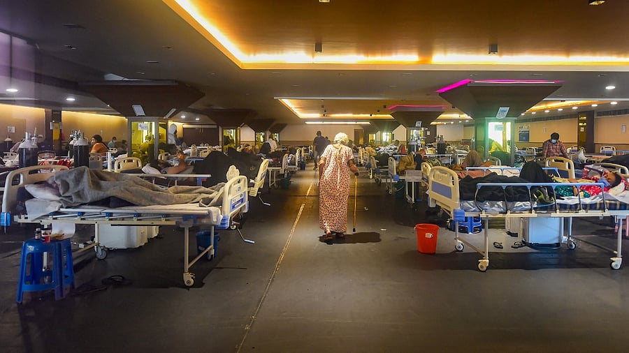 Covid-19 patients receive treatment at a banquet hall, converted into an isolation centre, in New Delhi. Credit: PTI Photo