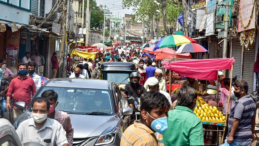 People throng markets ahead of coronavirus lockdown in the state. Credit: DH Photo