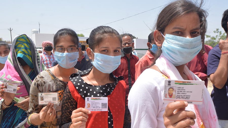 Citizens stand in a queue to cast their vote during the 2nd phase of Panchyat Elections, in Lucknow, Monday, April 19, 2021. Credit: PTI Photo