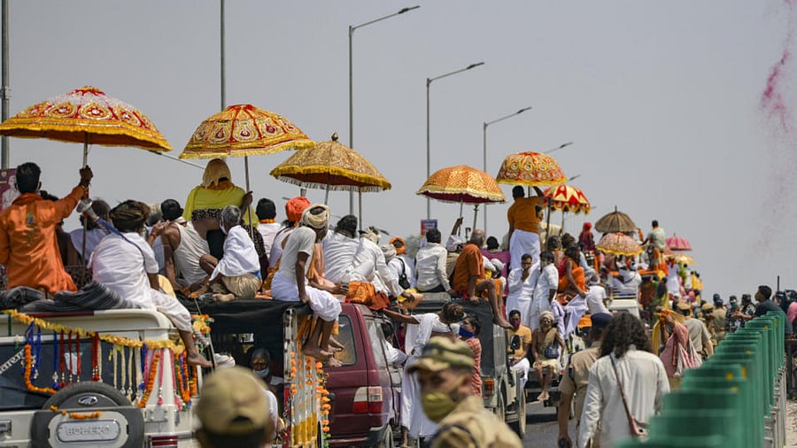 Akhada sadhus arriving to take bath at Har Ki Pauri during 3rd Shahi Snan of ongoing Kumbh Mela 2021, in Haridwar, Wednesday, April 14, 2021. 