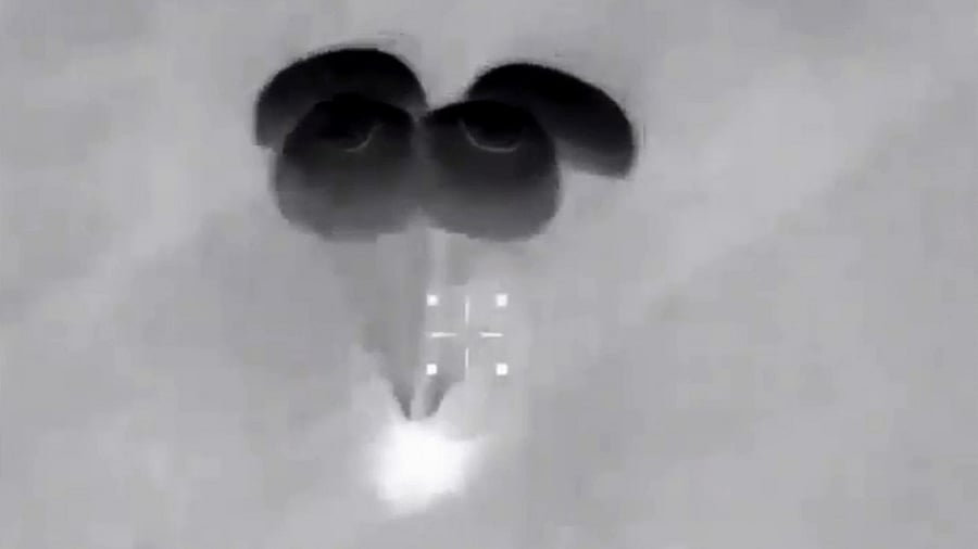 This screen grab taken from the NASA live feed early on May 2, 2021 shows the SpaceX's Crew Dragon spacecraft, with parachutes open, returning to Earth as it carries four astronauts just before splashdown off the coast of Panama City in the US state of Florida. Credit: AFP/NASA Photo