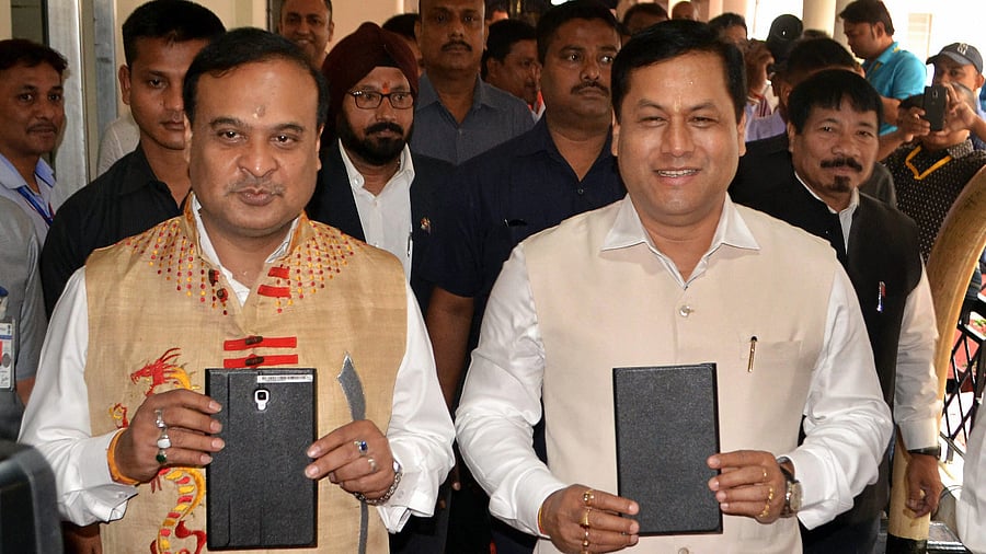 Assam CM Sarbananda Sonowal (Left) and Health minister Himata Sarma. Credit: PTI Photo