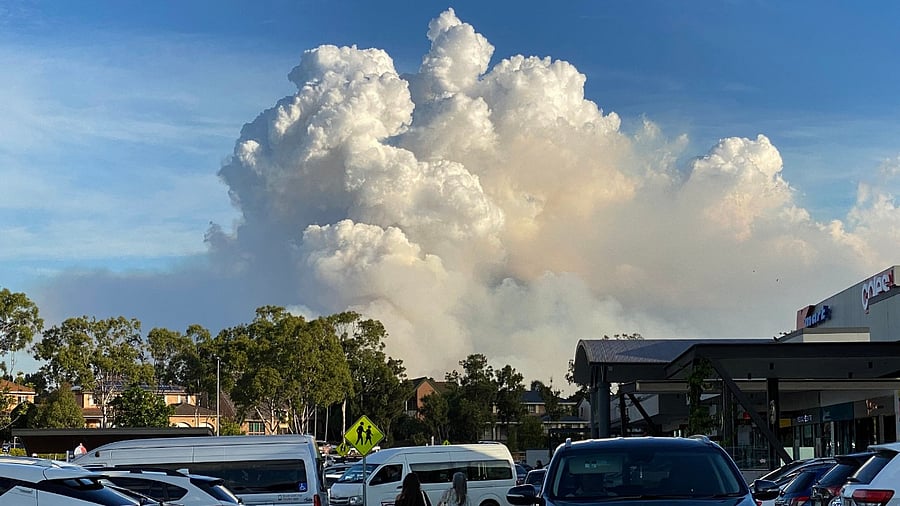 This picture taken on May 2, 2021 shows smoke filling the sky as Sydney is enveloped in a thick bank of hazardous bushfire smoke forcing authorities in Australia's largest city to scale back controlled forest burning nearby. Credit: AFP Photo