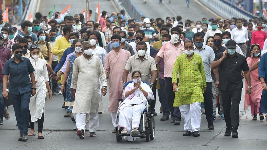 TMC party supremo and West Bengal Chief Minister Mamata Banerjee during a roadshow in support of her party candidates for the ongoing State Assembly Polls, in Kolkata, Sunday, April 18, 2021. Credit: PTI Photo