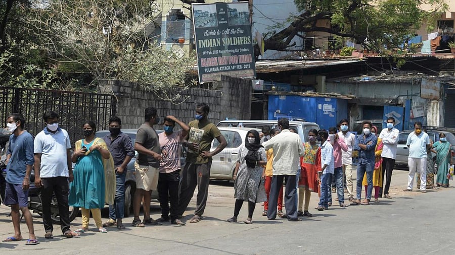 eople stand in a queue to register for a Covid-19 coronavirus test at a primary health centre in Hyderabad. Credit: AFP Photo.